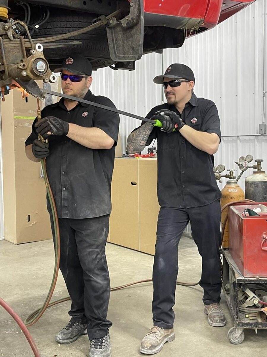 Two SouthSide Body & Bike technicians in the shop in Menomonie, Wisconsin