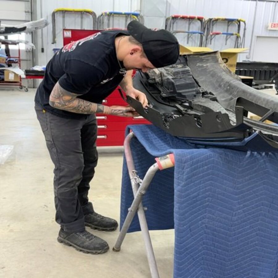 Bodywork in progress on a vehicle panel at SouthSide Body & Bike