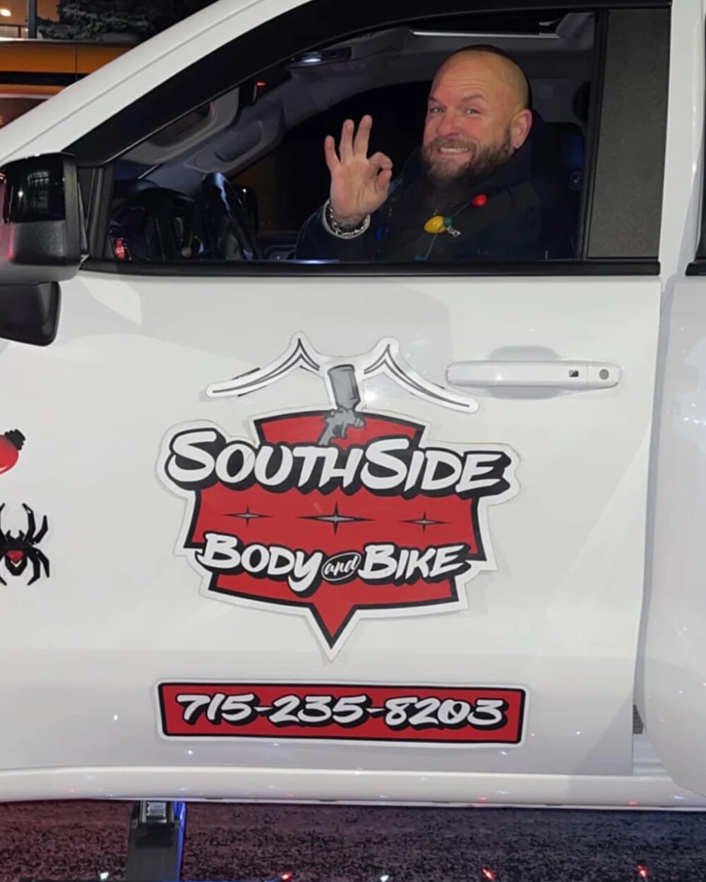 A SouthSide Body & Bike owner in a branded shop truck in Menomonie, Wisconsin